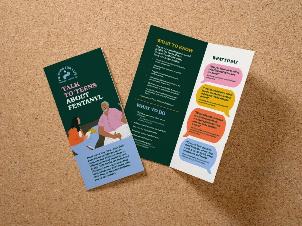 Bifold brochure showing a teen with dark hair and an adult with a pink shirt talking