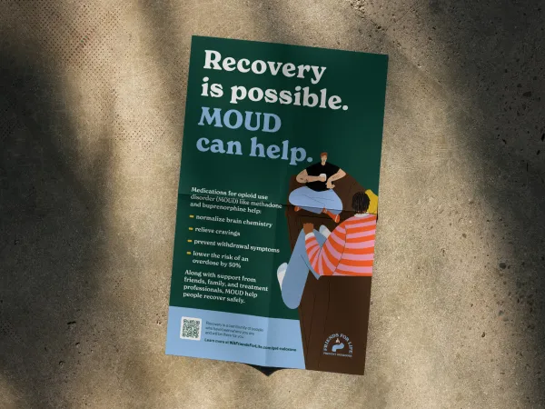 Image of a poster with dark background and two people talking on a couch